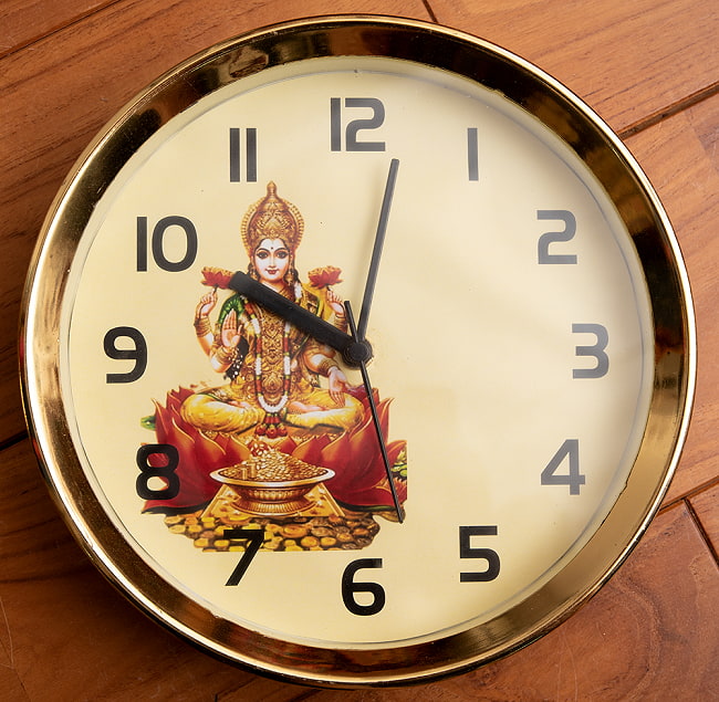 神様壁掛時計 - Laxmi - ラクシュミー【インド現地クオリティ】の写真1枚目です。豊穣の神様ラクシュミーが印刷された神様時計です壁掛時計,神様時計,インドの時計,時計,クロック,ラクシュミー
