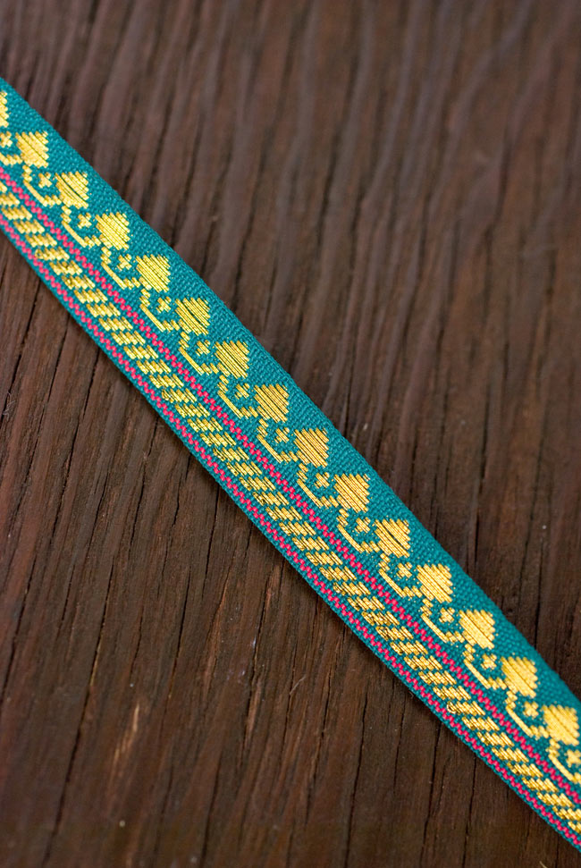 (幅:約1cm)細幅のチロリアンテープ(1m売り) - 青緑 2 - インドではサリーの飾り付けなどに用いられています。