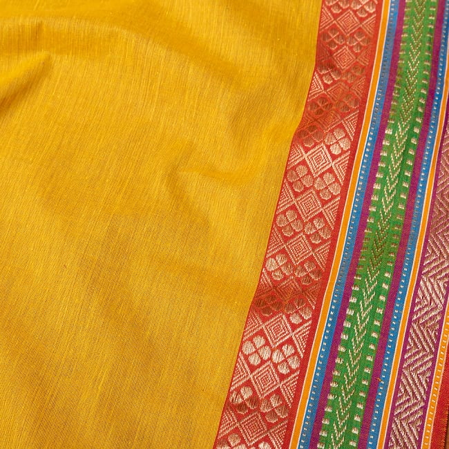 南インドのハーフボーダー・シンプル・コットン布〔幅約110cm〕 - オレンジ系の商品写真 3枚目 1mの長さごとにご購入いただけます。