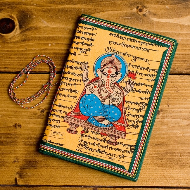 〈18cm×12cm〉インドの神様柄紙メモ帳 - ガネーシャの写真1枚目です。インドの雰囲気たっぷり！ノートや手帳としてご使用いただけます。メモ帳,ノート,神様,手帳